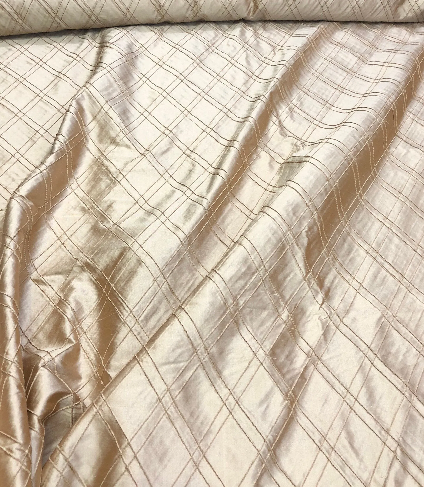 Silk shantung pintuck 52&quot; wide    Beautiful champagne color silk shantung pintuck fabric sold by the yard