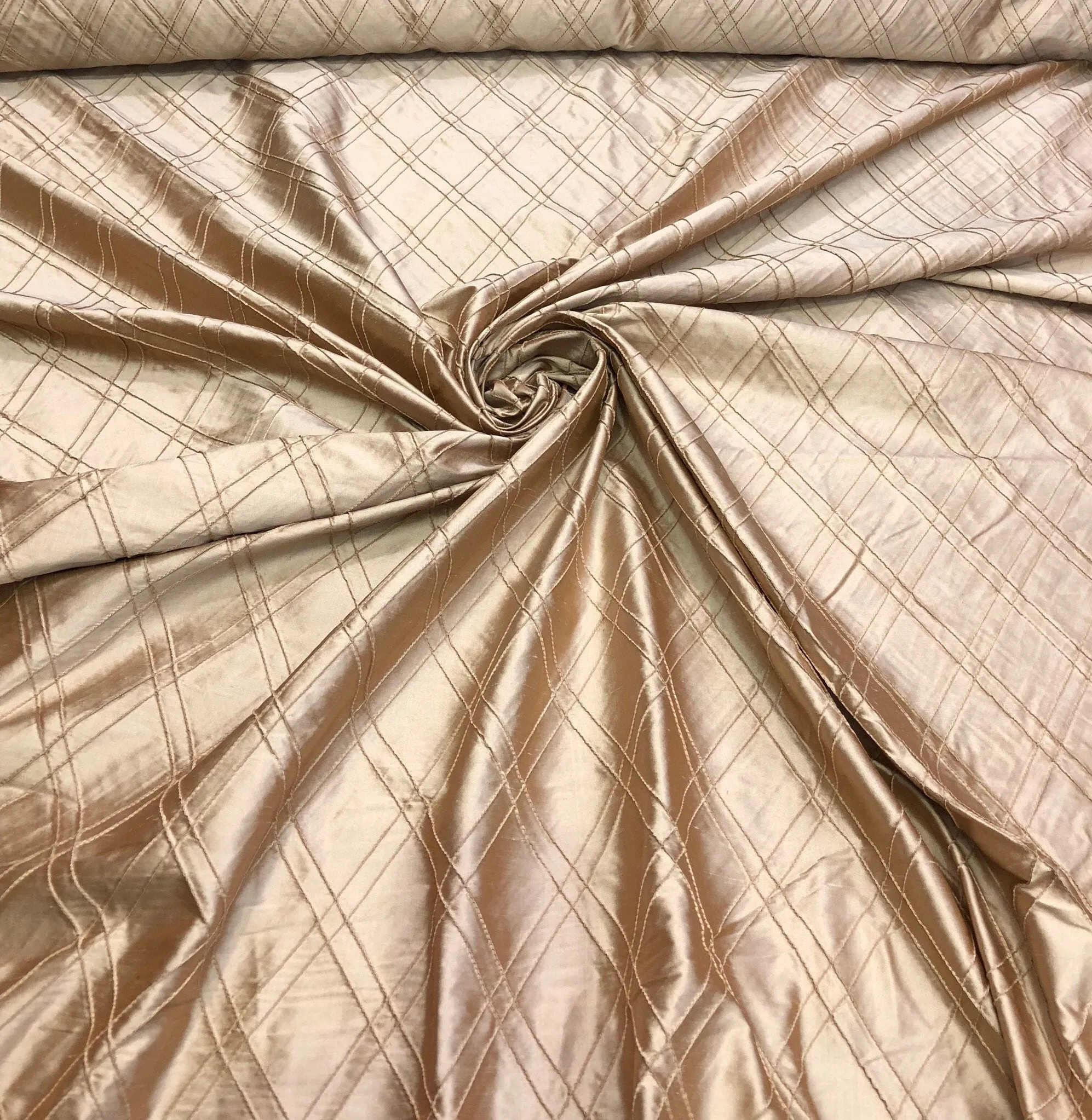 Silk shantung pintuck 52&quot; wide    Beautiful champagne color silk shantung pintuck fabric sold by the yard