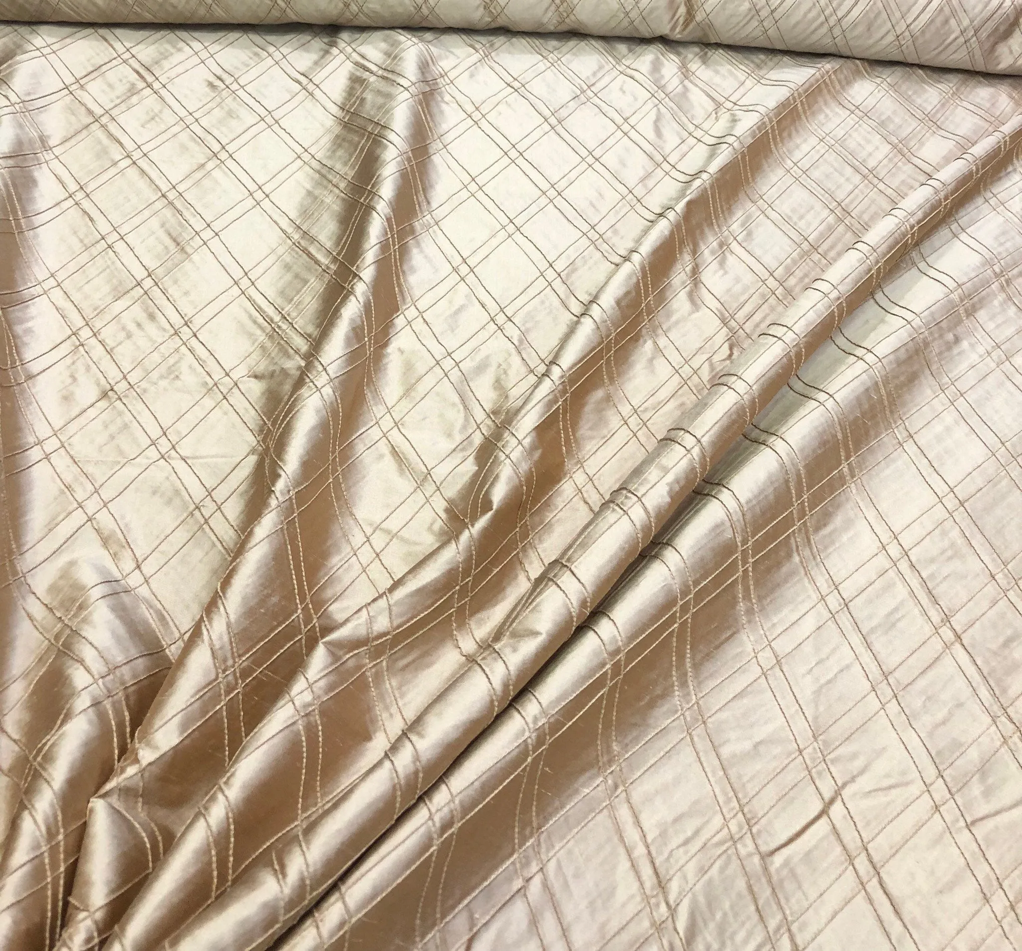 Silk shantung pintuck 52&quot; wide    Beautiful champagne color silk shantung pintuck fabric sold by the yard