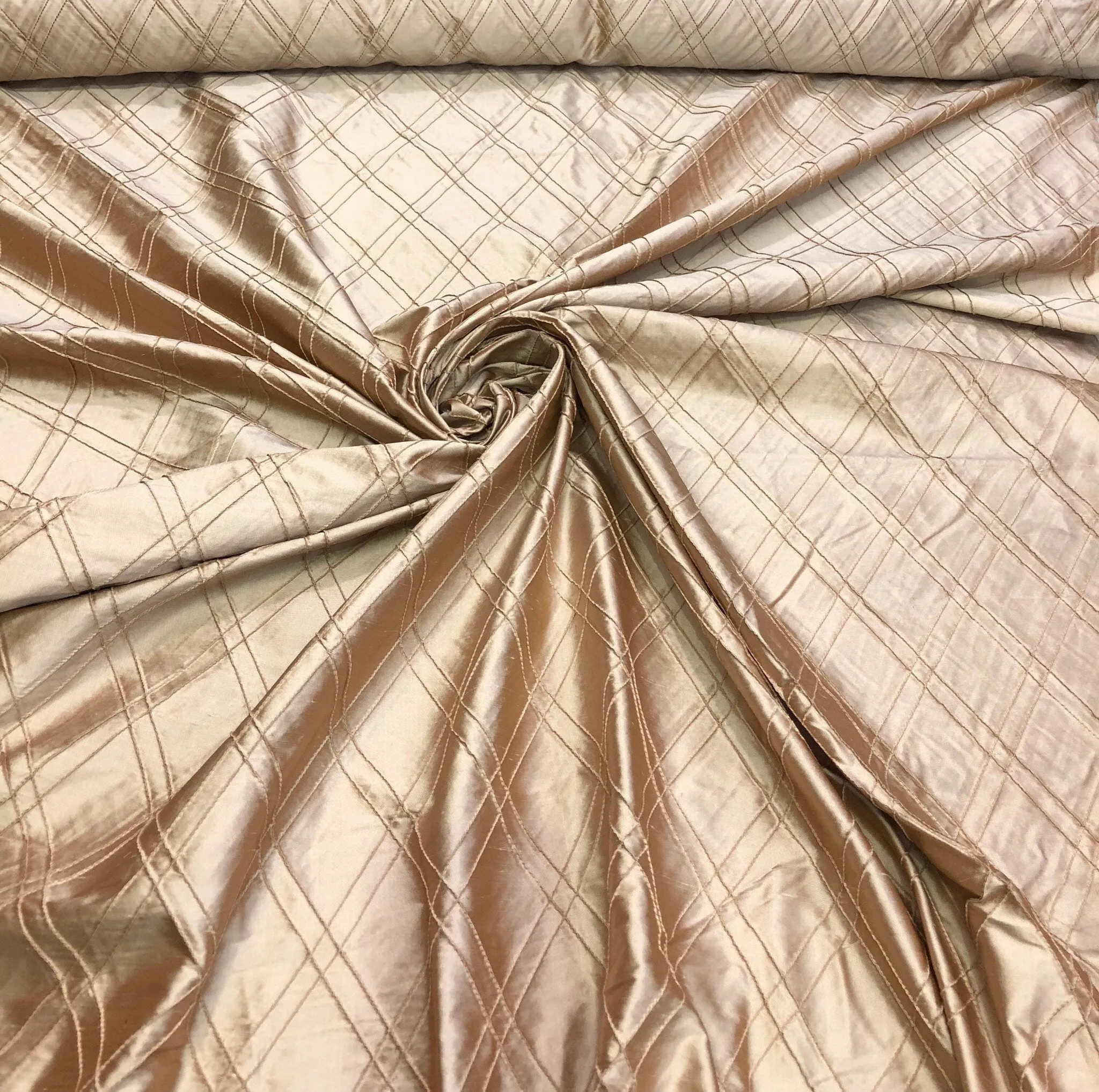 Silk shantung pintuck 52&quot; wide    Beautiful champagne color silk shantung pintuck fabric sold by the yard
